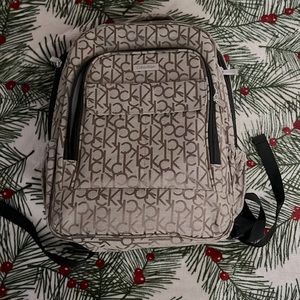 Backpack, laptop slot, two drink carriers, 4 pockets (3 zipper pockets)